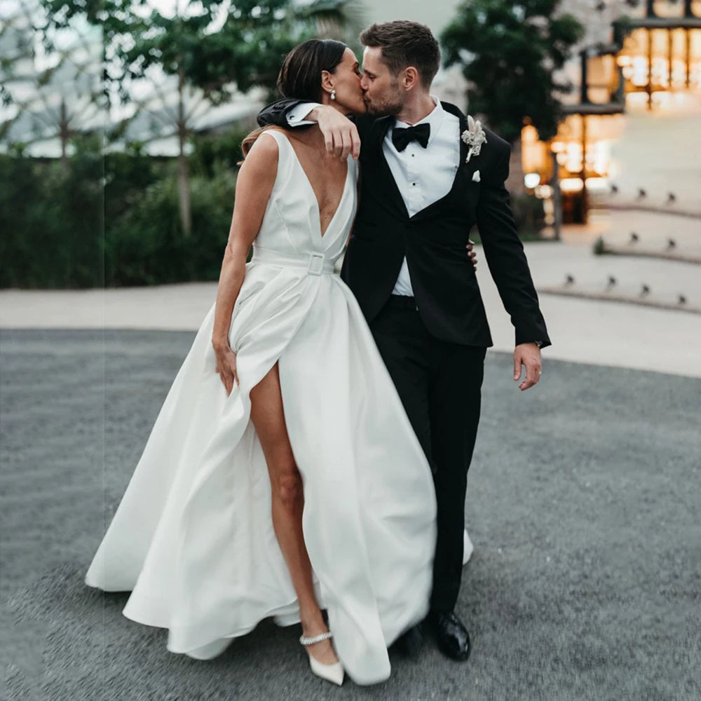 Indulge in the luxurious simplicity of the Robe Aude. Handcrafted from the finest satin, this custom-made wedding dress features a high split and open back, adding a touch of sensuality to its minimalist design. Ruched details complete the look, creating a luxe and elegant dress for your special day.