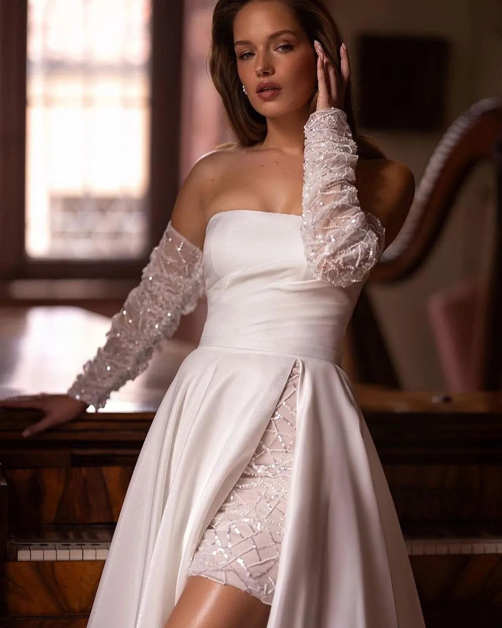 Elevate your bridal look with our Robe Noémie. Crafted with shimmering sequins and delicate beading, this satin dress exudes sophistication. The detachable train offers versatility, while the off the shoulder design adds a touch of romance. Perfect for the modern bride looking for a statement dress.