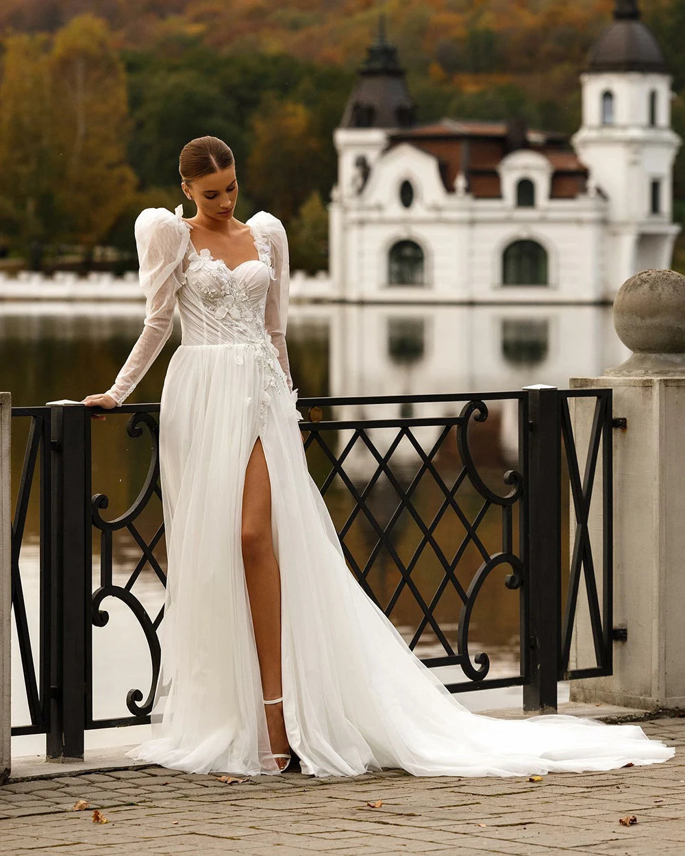 Indulge in luxury with our Robe Sixtine. This elegant Boho wedding dress features delicate lace appliques, an open back, and intricate beading. The long sleeves add a touch of sophistication while the floral details evoke the beauty of a royal wedding. Make a statement on your special day.