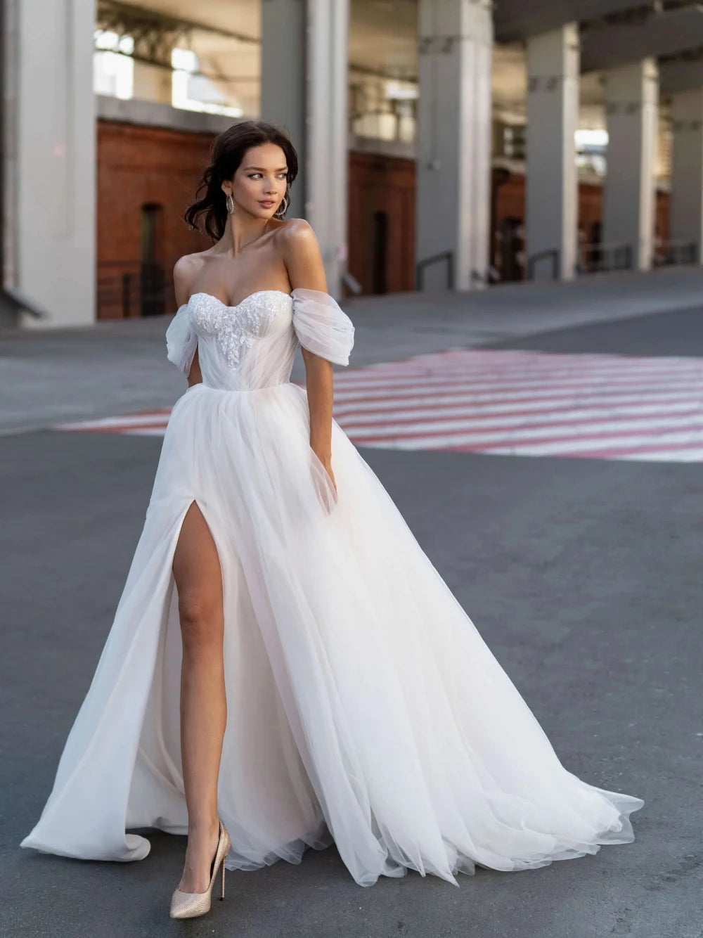 Indulge in pure luxury with our Robe Lova. This elegant off the shoulder wedding dress features sparkling sequins and beads, perfect for the modern bride. Its A-line silhouette flatters all body types, while the pristine white color adds an air of sophistication. Make a statement on your special day with this exclusive piece.