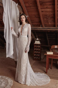 The Aveline wedding dress is perfect for looking beautiful and confident on your special day. The sexy mermaid cut and deep V neckline give you an elegant silhouette while the lace detail and long sleeves add a romantic touch. Create your dream bridal look with this stunning gown.
