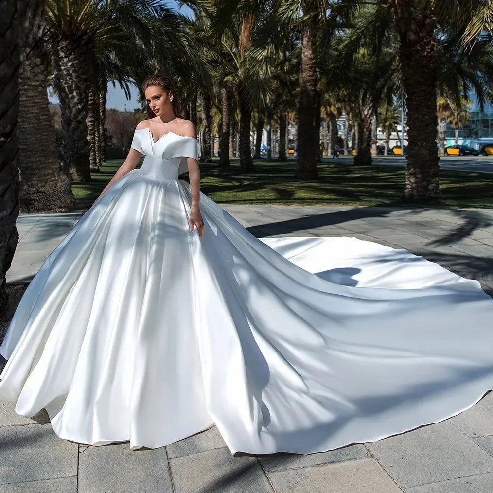 Experience the ultimate in luxury and style with our Robe Victoire. Crafted with elegant matte satin, this ball gown wedding dress will make you feel like royalty on your special day. Its timeless design and impeccable fit will leave you feeling confident and beautiful.