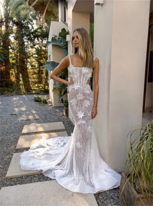 Upgrade your wedding look with our Robe Marilyn. This mermaid lace bridal gown will enhance your figure while adding a touch of elegance. Embrace your inner Marilyn and feel confident on your special day.
