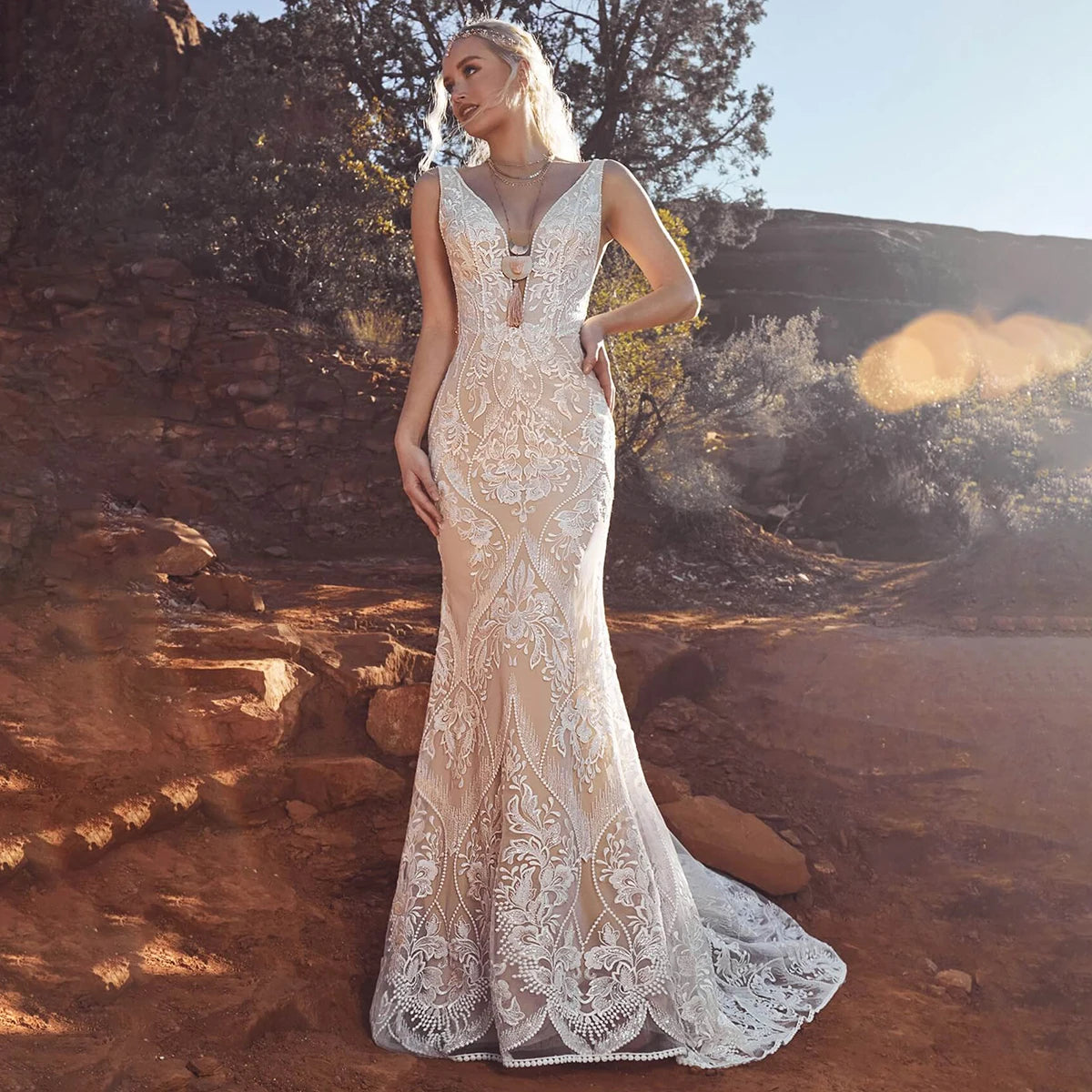 Unleash your inner mermaid with Dress Marina! Its long elastic batwing sleeves and elegant mermaid silhouette make it the ideal lace wedding dress for beachside nuptials. And let's not overlook the dazzling sequin accents - you'll radiate like the night sky in this captivating gown.