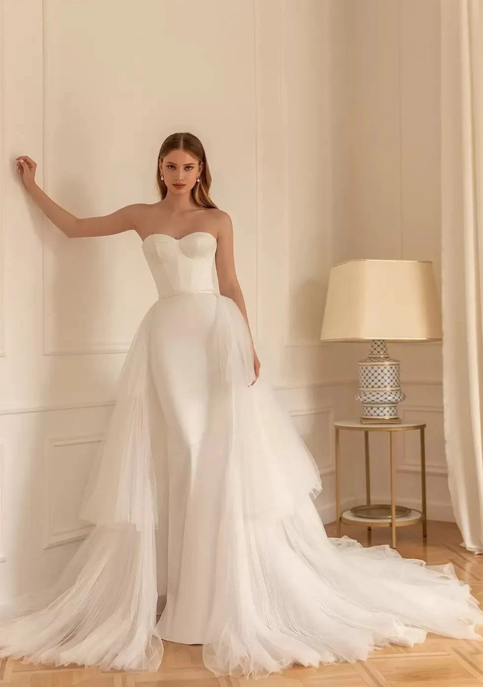 Be the epitome of elegance on your big day with Dress Elaine. Featuring a sweetheart neckline and a sleek sheath silhouette, this wedding dress will surely make you stand out. Prepare to say "I do" in style with this stunning bridal gown.