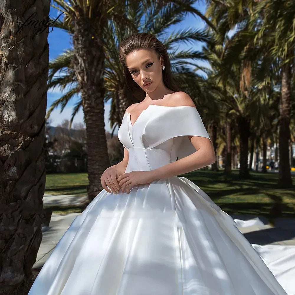 Experience the ultimate in luxury and style with our Robe Victoire. Crafted with elegant matte satin, this ball gown wedding dress will make you feel like royalty on your special day. Its timeless design and impeccable fit will leave you feeling confident and beautiful.
