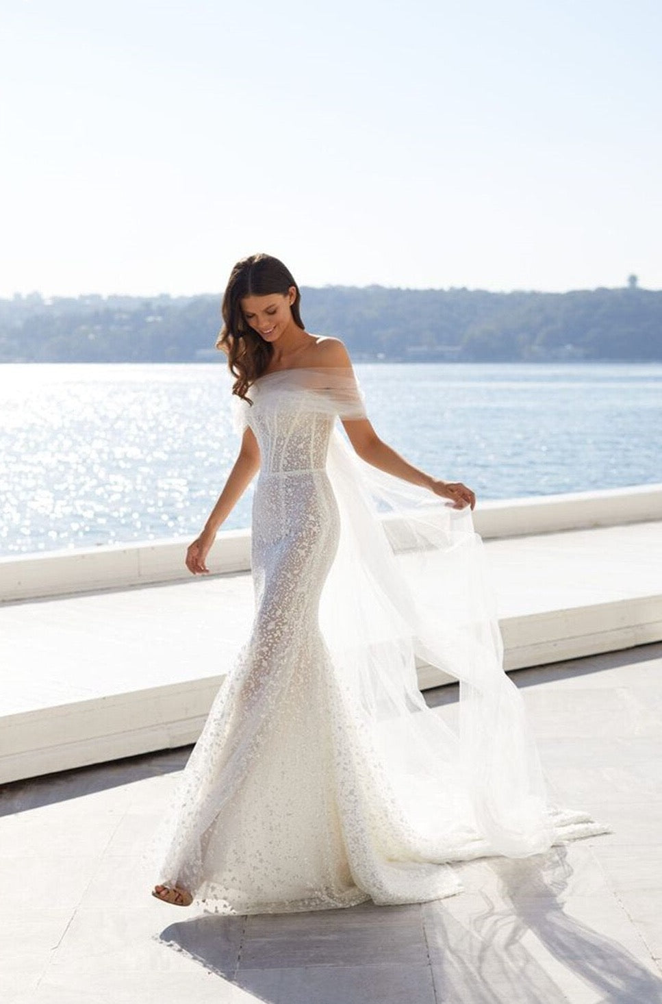 Look like a queen in our stunning Jessie Robe! Illuminating the room with its mermaid lace and off-the-shoulder silhouette, this bridal gown will make you feel like you're ready to rule the night. So, don your crown and get ready for the royal treatment you deserve!