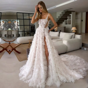 Get ready to walk down the aisle in style with our Robe Marlenne. This stunning dress features delicate flowers, a flattering square neckline, and elegant spaghetti straps. The A-line silhouette and lace detailing add a touch of romance to your special day. Say "I do" to this perfect wedding dress.