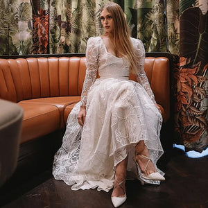 Discover the perfect wedding gown for your special day with Robe Monet's Floral Lace Sequined Square Neck gown. Sheer long sleeves and a low cut two pieces crop top adorn the modern chic look. Plus size design ensures an elegant and stylish fit for every bride. Make your dream come true in this beautiful bridal dress!