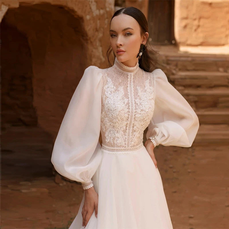 Get ready to shine on your special day with the Robe Lune! This elegant ivory white wedding dress features beautiful bubble long sleeves and high work embroidery, making it perfect for a haute couture look. You'll feel like a true bride in this stunning bridal gown. Order now and make your wedding day unforgettable!