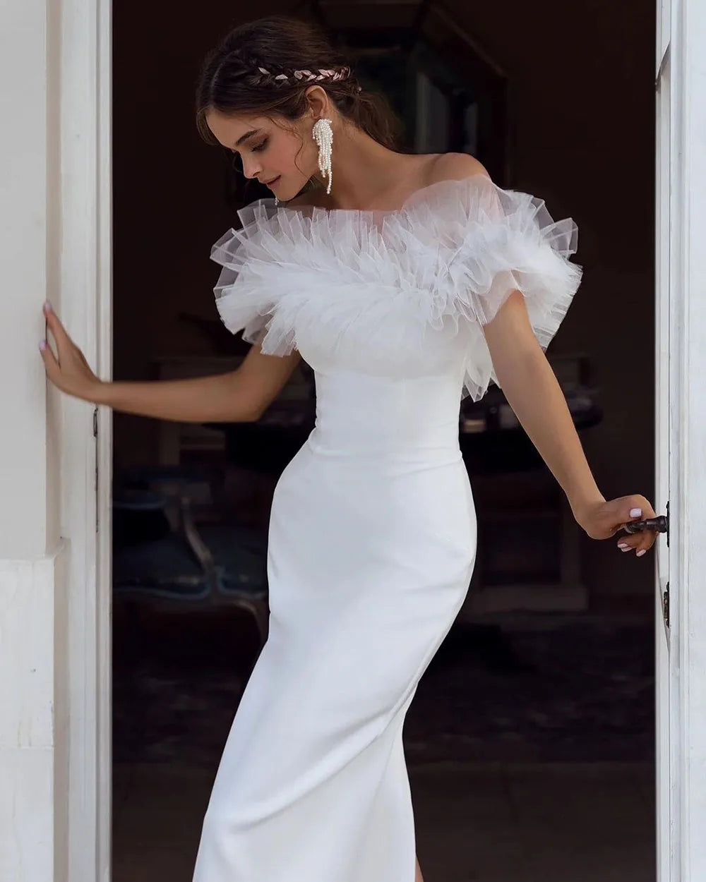 Indulge in the feminine allure of our Robe Allura. This mermaid wedding dress features elegant pleats, a flattering off-the-shoulder design, and a sophisticated backless silhouette. Made from premium elastic satin, this dress is the epitome of luxury and will make any bride feel like royalty.