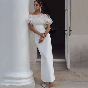 Indulge in the feminine allure of our Robe Allura. This mermaid wedding dress features elegant pleats, a flattering off-the-shoulder design, and a sophisticated backless silhouette. Made from premium elastic satin, this dress is the epitome of luxury and will make any bride feel like royalty.