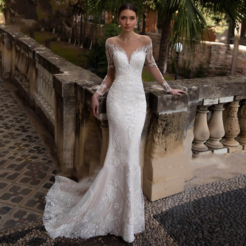 Be the talk of the aisle in this luxurious, vintage-style Harriett Dress. Crafted from exquisite embroidered lace and net with a detachable train, this statement gown features a V-neck sleeveless silhouette to exude sophistication and femininity. Perfect for a one-of-a-kind wedding look with timeless grace, the Harriett Dress is a special and exclusive choice.