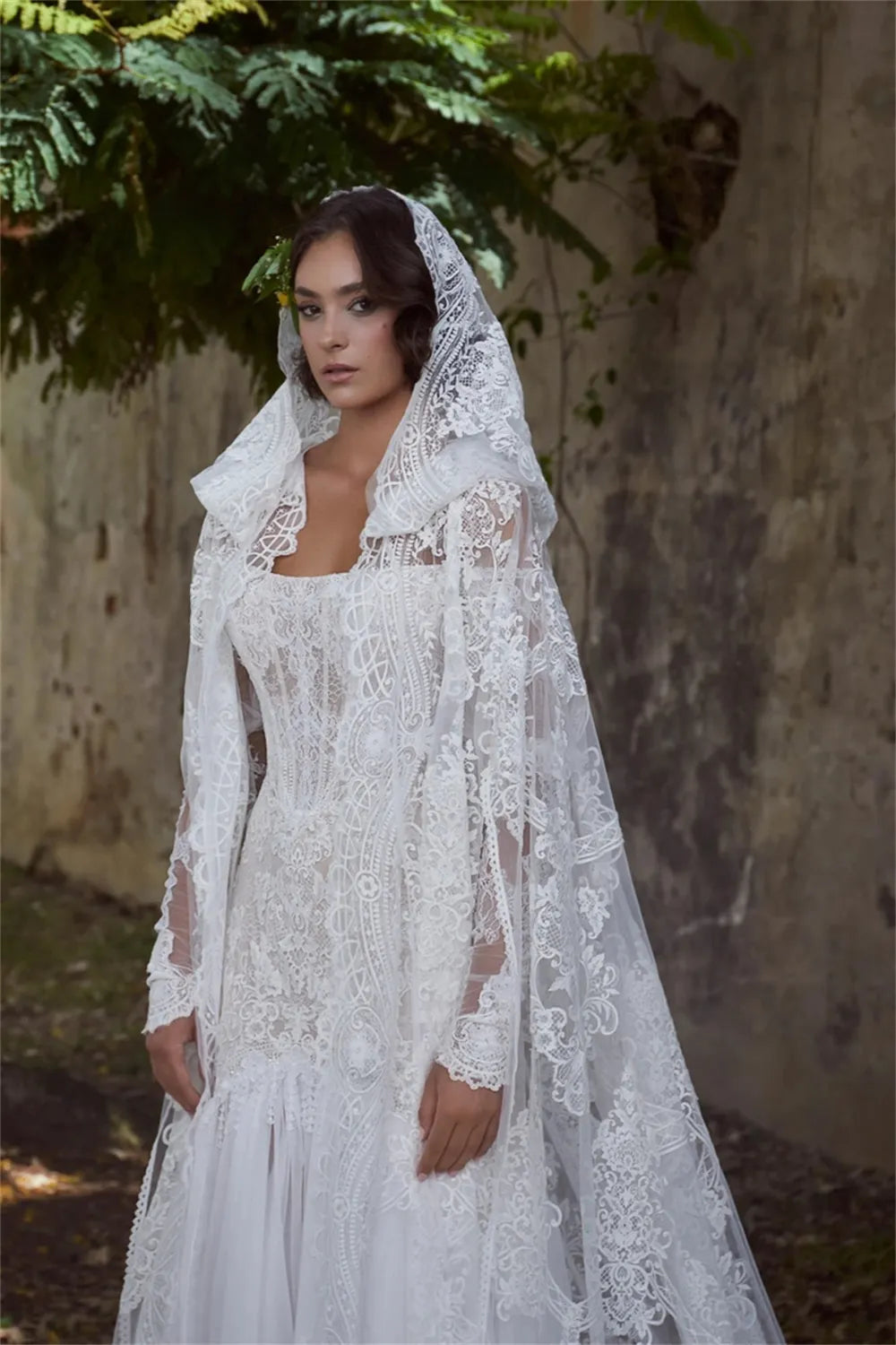 Experience true luxury with the Sabine Robe. This eye-catching floor-length gown features a beautiful mermaid silhouette with a sexy bateau neckline, a daring cut-out open back, and glimmering lace appliqués. Slay the aisle in this statement-making ensemble fit for royalty!