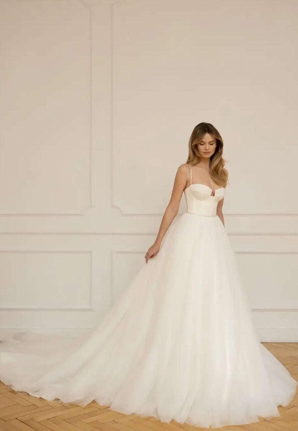 Look sensational in Christina's luxurious wedding dress! Featuring a classic sweetheart neckline and spaghetti straps, this a-line gown adds effortless grace to any special day. Delicate beading and hand-crafted details ensures a beautiful and timeless look that celebrates your special day.