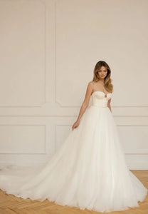 Look sensational in Christina's luxurious wedding dress! Featuring a classic sweetheart neckline and spaghetti straps, this a-line gown adds effortless grace to any special day. Delicate beading and hand-crafted details ensures a beautiful and timeless look that celebrates your special day.
