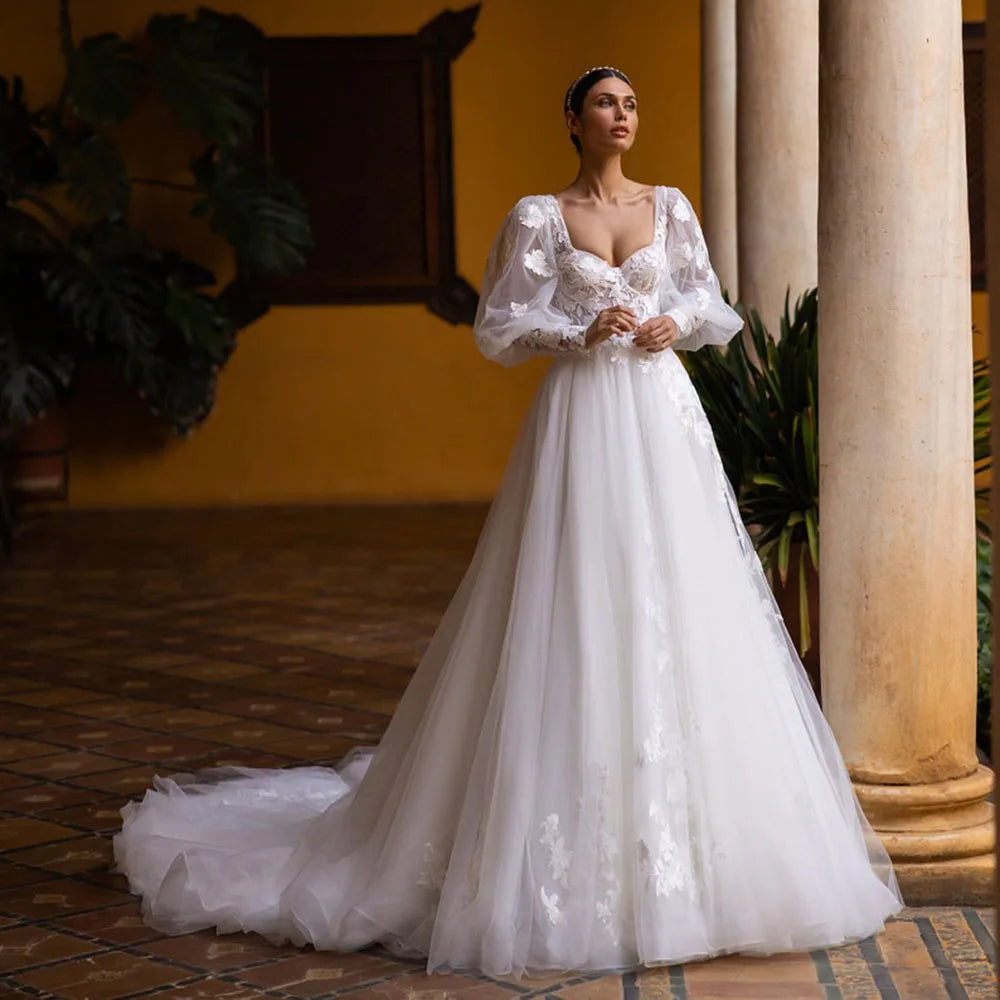 Exude elegance and sophistication in our Robe Indre. This puffy, lace-up princess bridal dress is adorned with delicate lace appliques, making it the perfect choice for a luxurious wedding. Feel like a beautiful princess on your special day with this exclusive gown.