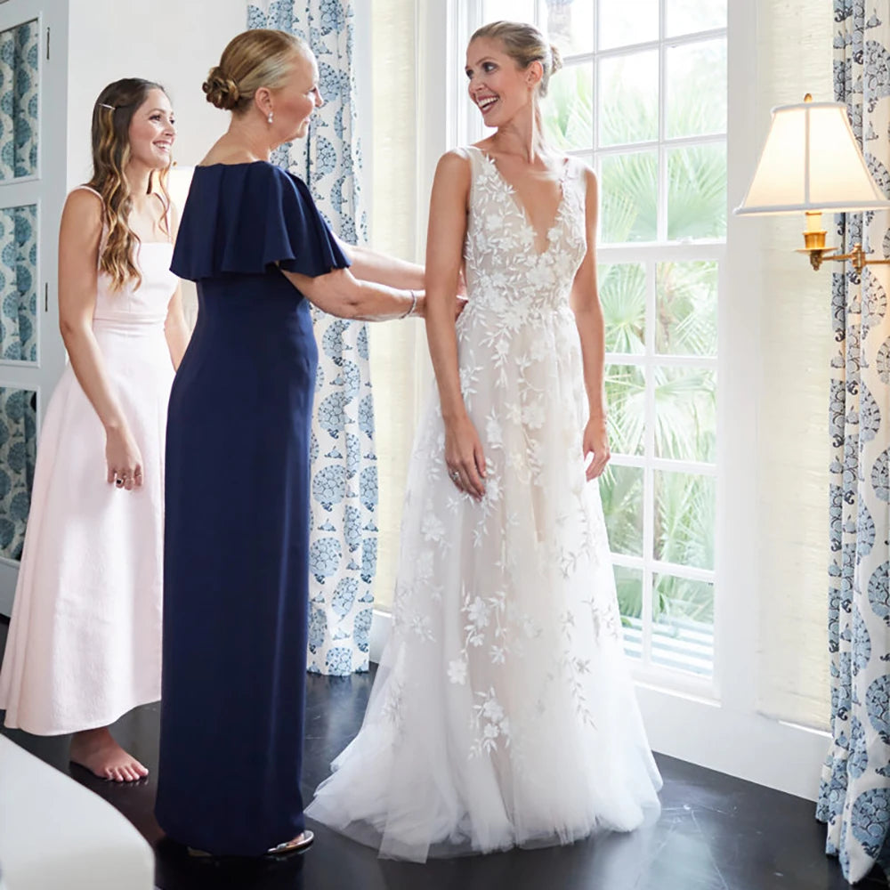 Featuring a romantic floral embroidered design, the Robe Alisha makes a stunning statement for your special day. With its custom-made V-neck open back and elegant tulle wings, this rustic maxi bridal gown exudes effortless grace and beauty. An unforgettable look that will turn heads and make you feel like royalty on your wedding day.