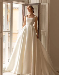 Feel like a princess on your special day with our Robe Sancia. The square neckline and full, long sleeve puff design adds elegance to the A-line silhouette. This two-piece bridal gown is perfect for any bride, ensuring a stunning and timeless look
