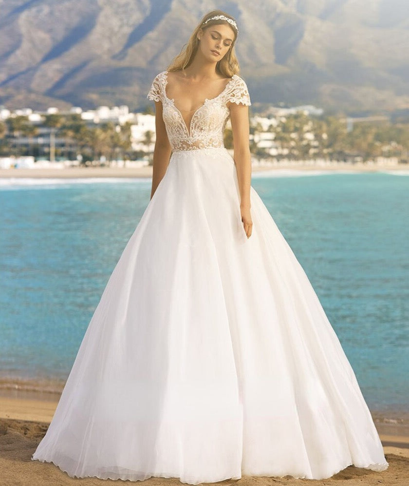 Look amazing for your special event in the chic and elegant Lucienne Gown. Its timeless formal occasion design is perfect for weddings, parties or evenings out, and will make sure you stand out from the crowd. Enjoy the sweet details of this beautiful dress and show off your best features in style.