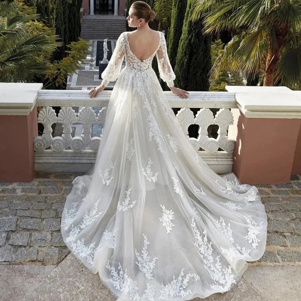 Elevate your special day with the Robe Khloe. This luxury wedding dress features long sleeves for a sophisticated touch, while the V-neck and backless design add a hint of sexiness. Indulge in the premium quality and craftsmanship of this bridal gown, making you feel like a true goddess on your wedding day.