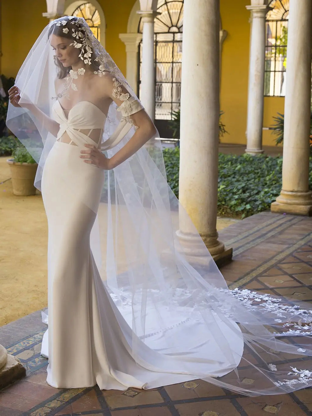 Get ready to be the belle of the ball with Dress Penelope! This mermaid-style wedding dress features an off-shoulder sweetheart neckline, pleated bodice, and an illusion corset back for a stunning silhouette. Made with luxurious crepe, you'll feel like a true bridal beauty. Say yes to Dress Penelope!