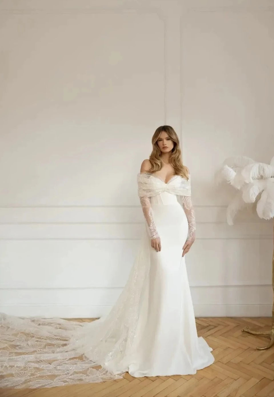 Put a sparkle in your special day with the gorgeous Robe Denisse! Featuring a sweetheart neckline with full long sleeves, this unique sheath bridal gown is sure to turn heads. Wearing it won't just make you look beautiful - you'll feel beautiful too! Make your wedding day unforgettable with Robe Denisse!