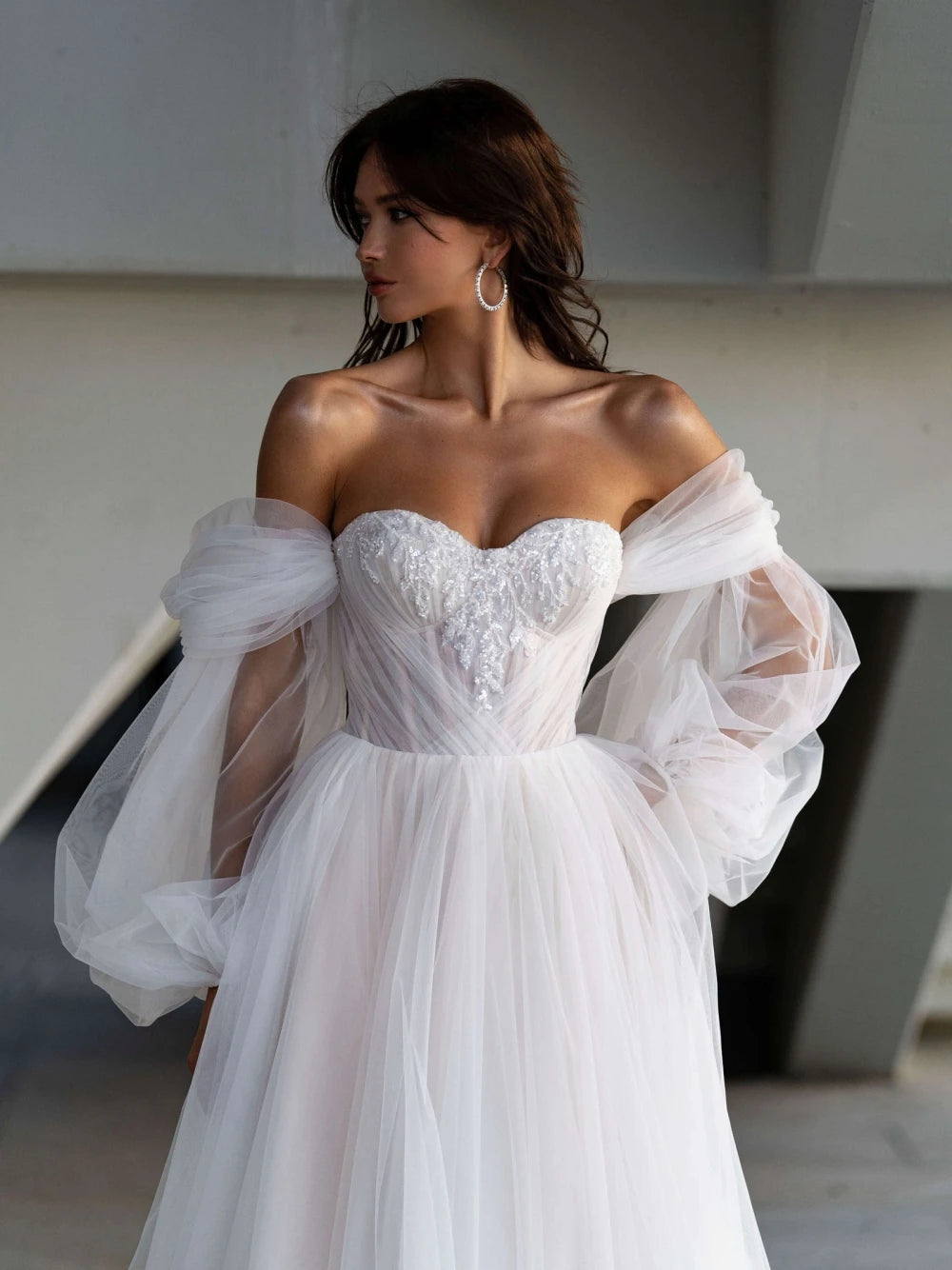Indulge in pure luxury with our Robe Lova. This elegant off the shoulder wedding dress features sparkling sequins and beads, perfect for the modern bride. Its A-line silhouette flatters all body types, while the pristine white color adds an air of sophistication. Make a statement on your special day with this exclusive piece.
