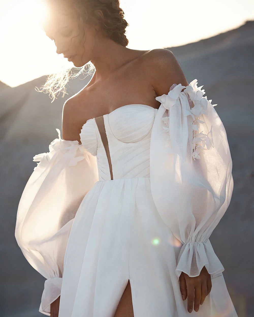 Looking for the perfect beach wedding dress? Look no further! Our Robe Angelique features an elegant deep V-neck design that will make you stand out on your special day. With its lightweight and flowy fabric, you'll feel comfortable and chic as you say "I do" with the ocean as your backdrop.