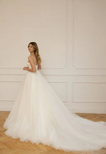 Look sensational in Christina's luxurious wedding dress! Featuring a classic sweetheart neckline and spaghetti straps, this a-line gown adds effortless grace to any special day. Delicate beading and hand-crafted details ensures a beautiful and timeless look that celebrates your special day.
