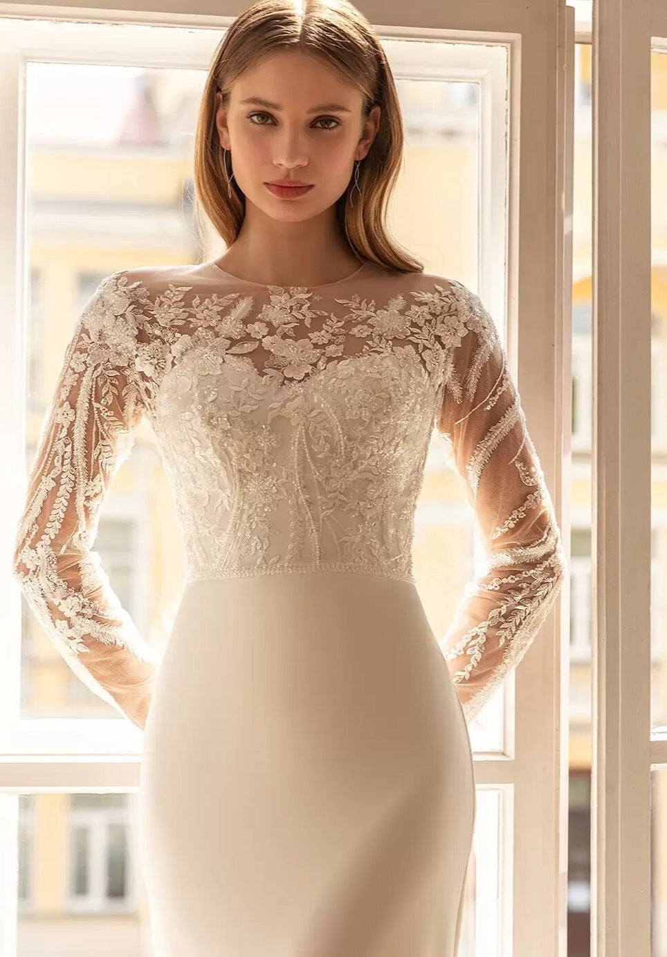 Upgrade your wardrobe with our elegant Robe Ashley. This stunning gown features intricate embroidered lace, creating a flattering mermaid silhouette. The chic long sleeves add a touch of sophistication to this must-have piece. Elevate your style and make a statement with Robe Ashley.