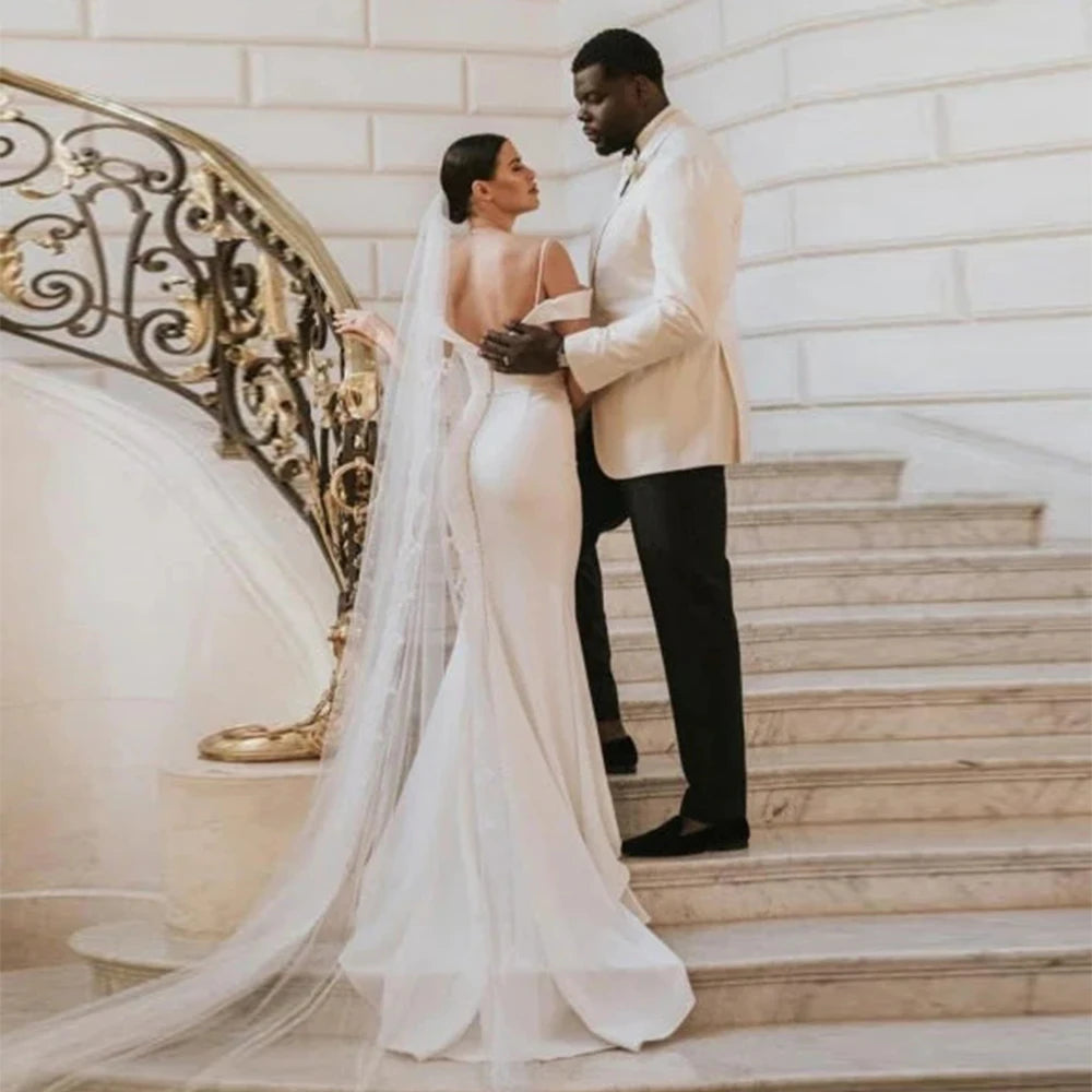 Capture hearts in the beautiful Satin Dress Emma. Custom made with exquisite details, this classic outdoor wedding dress is perfect for a stunning and elegant look on your special day. Enjoy the open design as you confidently walk down the aisle. Make a statement that will be remembered forever.