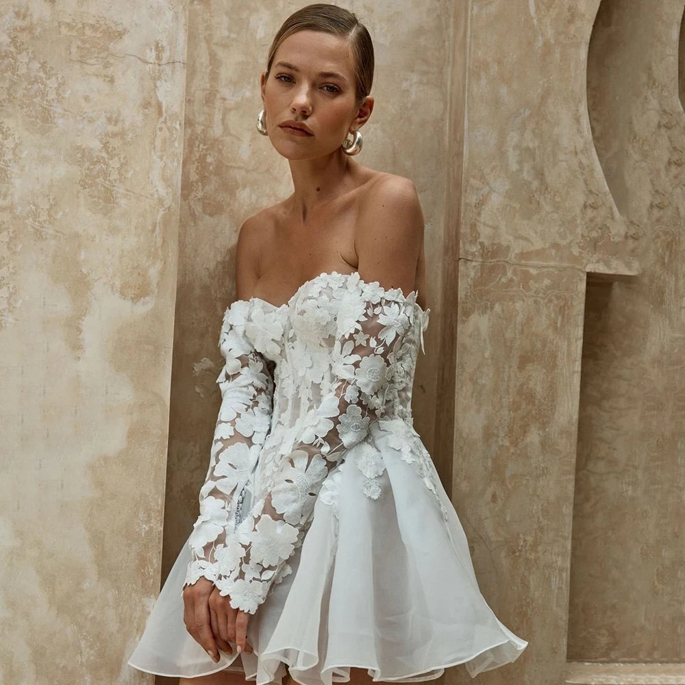 Indulge in luxury and sophistication with Dress Julianne. This stunning bridal gown features delicate embroidery and long sleeves for a timeless and elegant look. The above-knee length and sweetheart neckline add a touch of modernity, while the custom-made organza fabric adds a dreamy, ethereal feel. Elevate your special day with this exquisite mini dress.