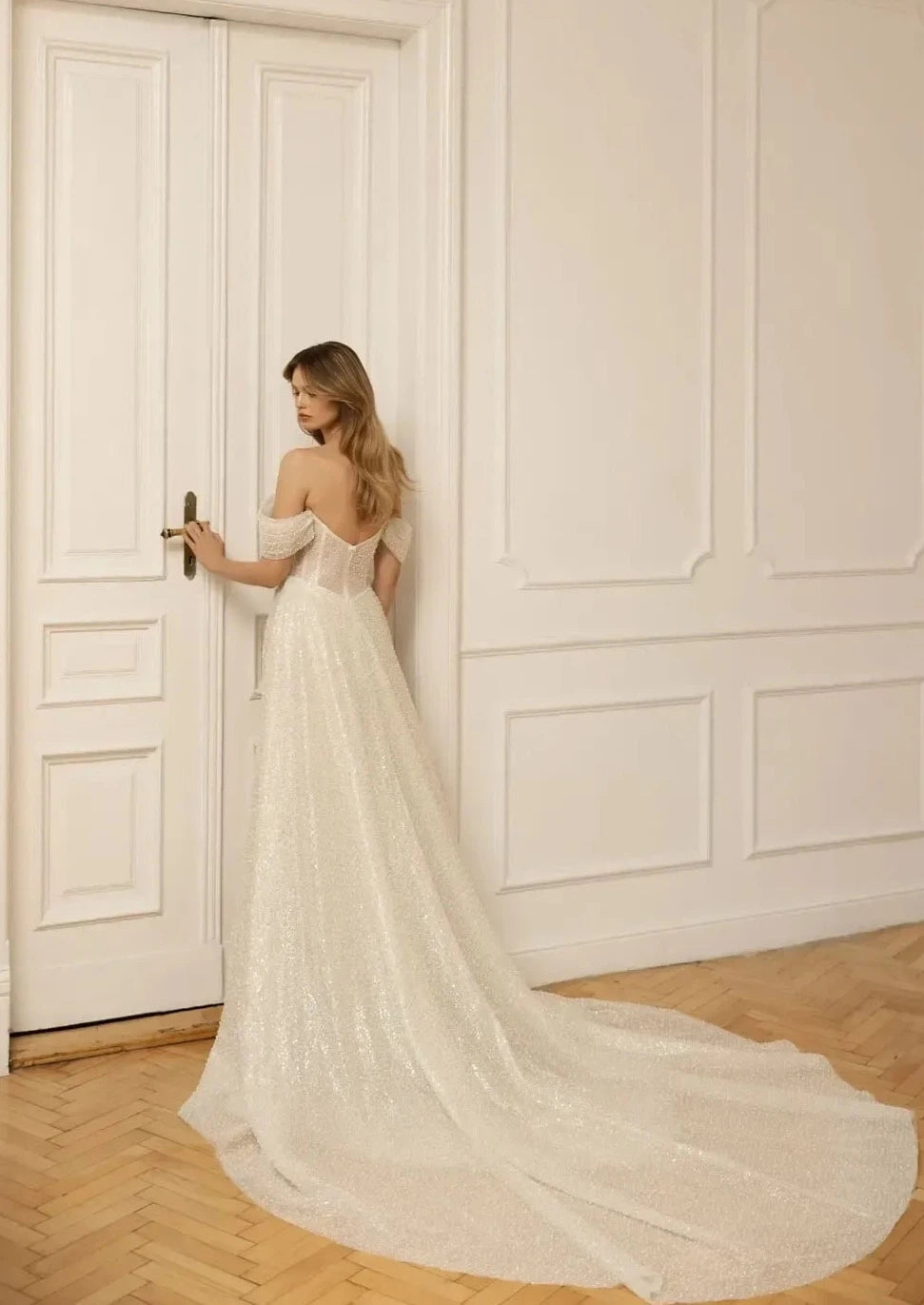 Slay the wedding game in the Robe Claretta! This stunning bridal gown features an elegant boat neckline and off the shoulder design, while the sheath silhouette and ruched details add a touch of sophistication. Get ready to turn heads down the aisle with this show-stopping piece.