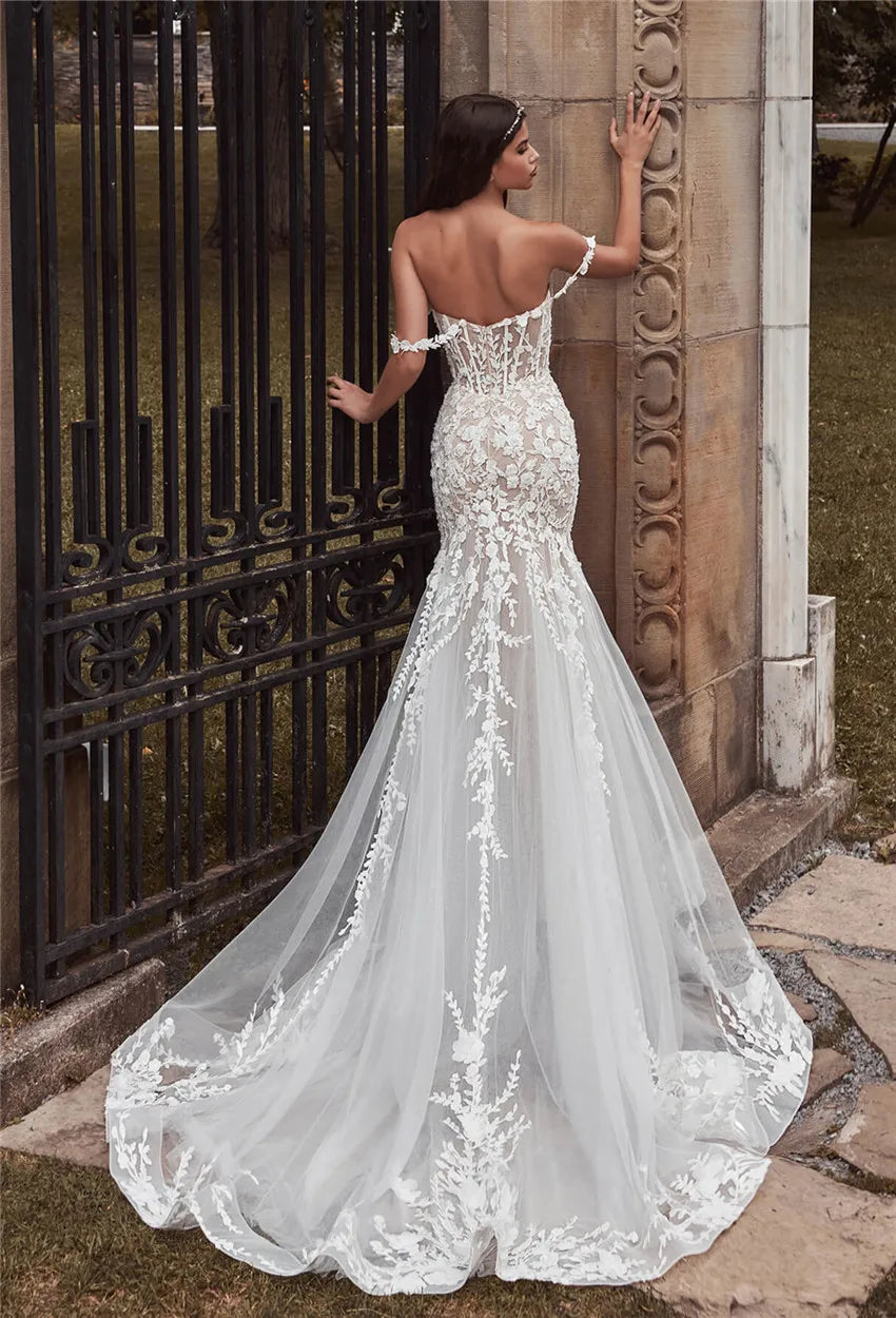 Adorn yourself in luxury with the Robe Olivette, a stunning lace wedding dress fit for a mermaid princess. This dress boasts intricate lace detailing and a form-fitting silhouette to enhance your natural beauty on your special day. Elevate your wedding look with the sophisticated elegance of the Robe Olivette.