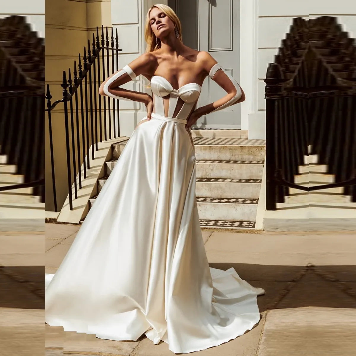 The Robe Nika is an elegant bridal gown, perfect for the modern minimalist bride. The strapless sweetheart neckline, A-line ball gown shape, and detached sleeves create a timeless look that will gracefully flatter any body type.