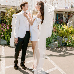 Look dreamy in this Mini Bridal Robe Lisette! Featuring a simple satin sheath fit with bow and custom-made elastic straps, you'll be the glamourous star of the show on your special day. Slip into this above-knee beauty and feel like the queen you are!