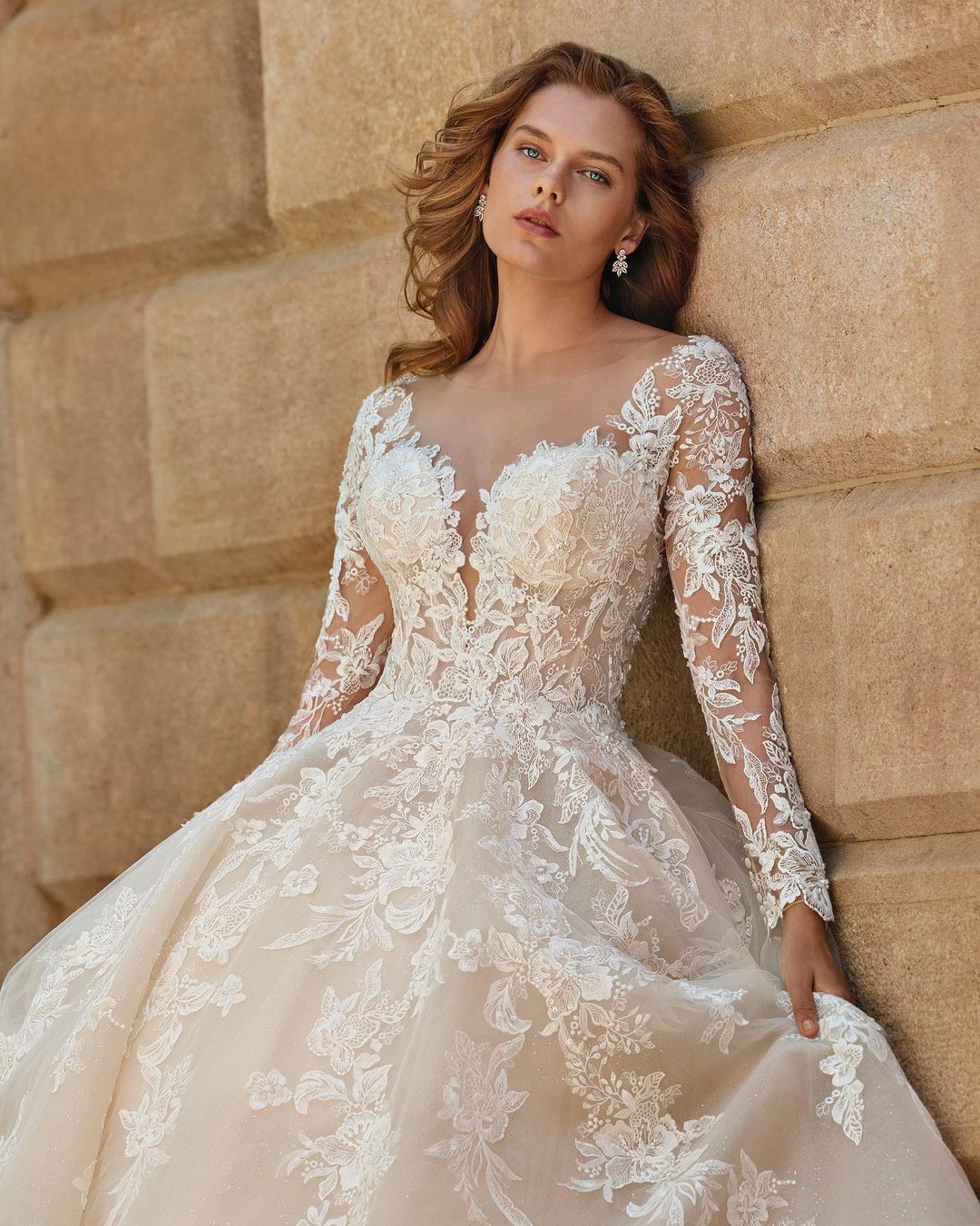 Elevate your bridal look with our Robe Adeline! This elegant lace gown features chic mid sleeves and a flattering A-line silhouette. The classic white color adds a touch of sophistication to your wedding ensemble. Make a statement on your special day with this must-have piece!