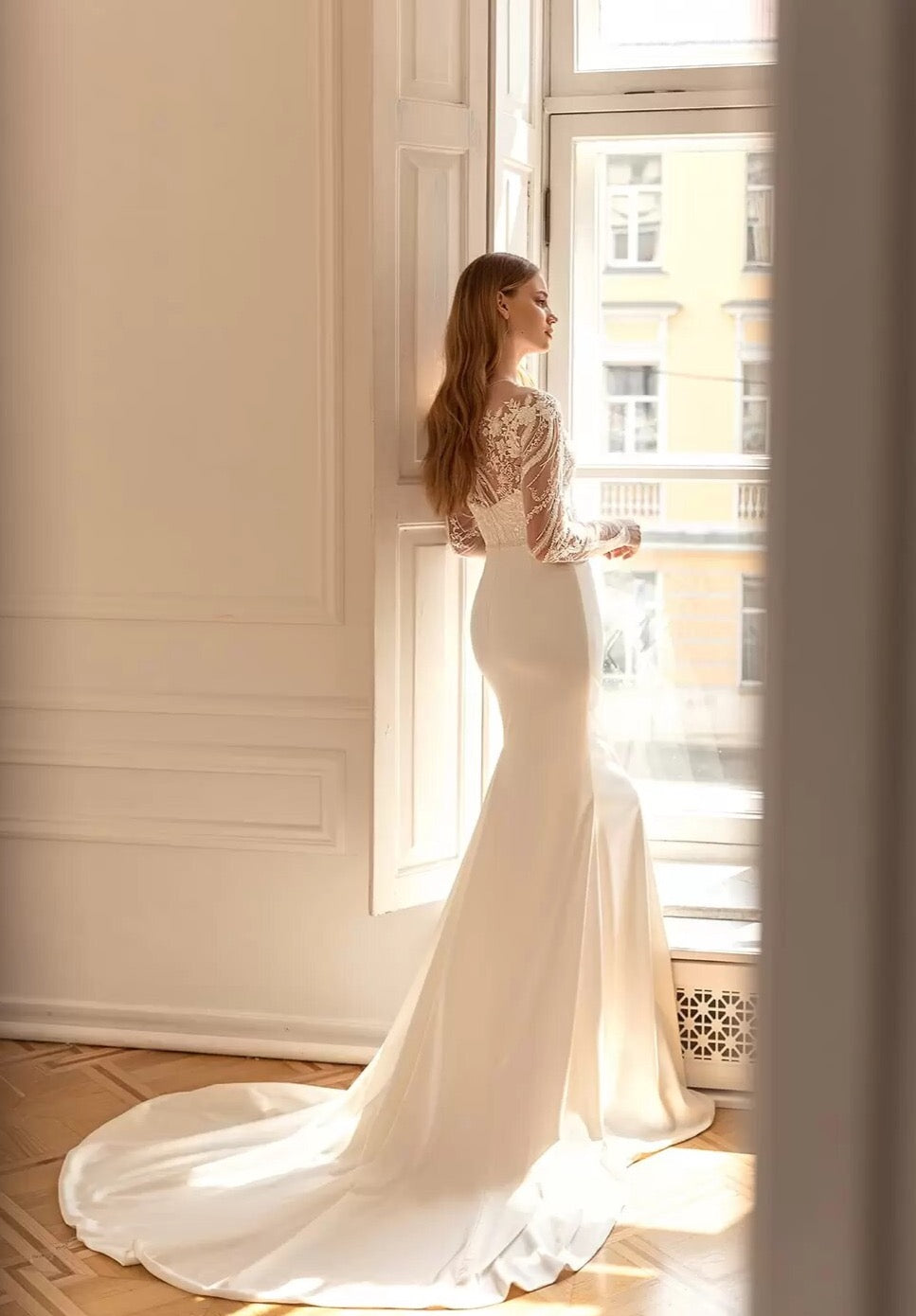 Upgrade your wardrobe with our elegant Robe Ashley. This stunning gown features intricate embroidered lace, creating a flattering mermaid silhouette. The chic long sleeves add a touch of sophistication to this must-have piece. Elevate your style and make a statement with Robe Ashley.