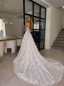 Indulge in pure elegance with our Robe Abrial. This Bohemia wedding dress features delicate 3D flowers, lace appliques, and spaghetti straps for a truly romantic look. Perfect for the modern-day princess bride, this dress will make you feel like royalty on your special day.
