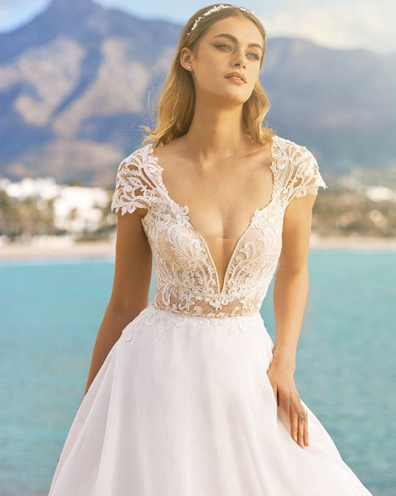 Look amazing for your special event in the chic and elegant Lucienne Gown. Its timeless formal occasion design is perfect for weddings, parties or evenings out, and will make sure you stand out from the crowd. Enjoy the sweet details of this beautiful dress and show off your best features in style.
