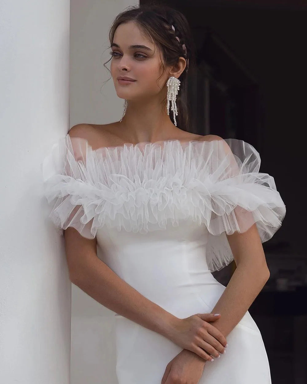 Indulge in the feminine allure of our Robe Allura. This mermaid wedding dress features elegant pleats, a flattering off-the-shoulder design, and a sophisticated backless silhouette. Made from premium elastic satin, this dress is the epitome of luxury and will make any bride feel like royalty.