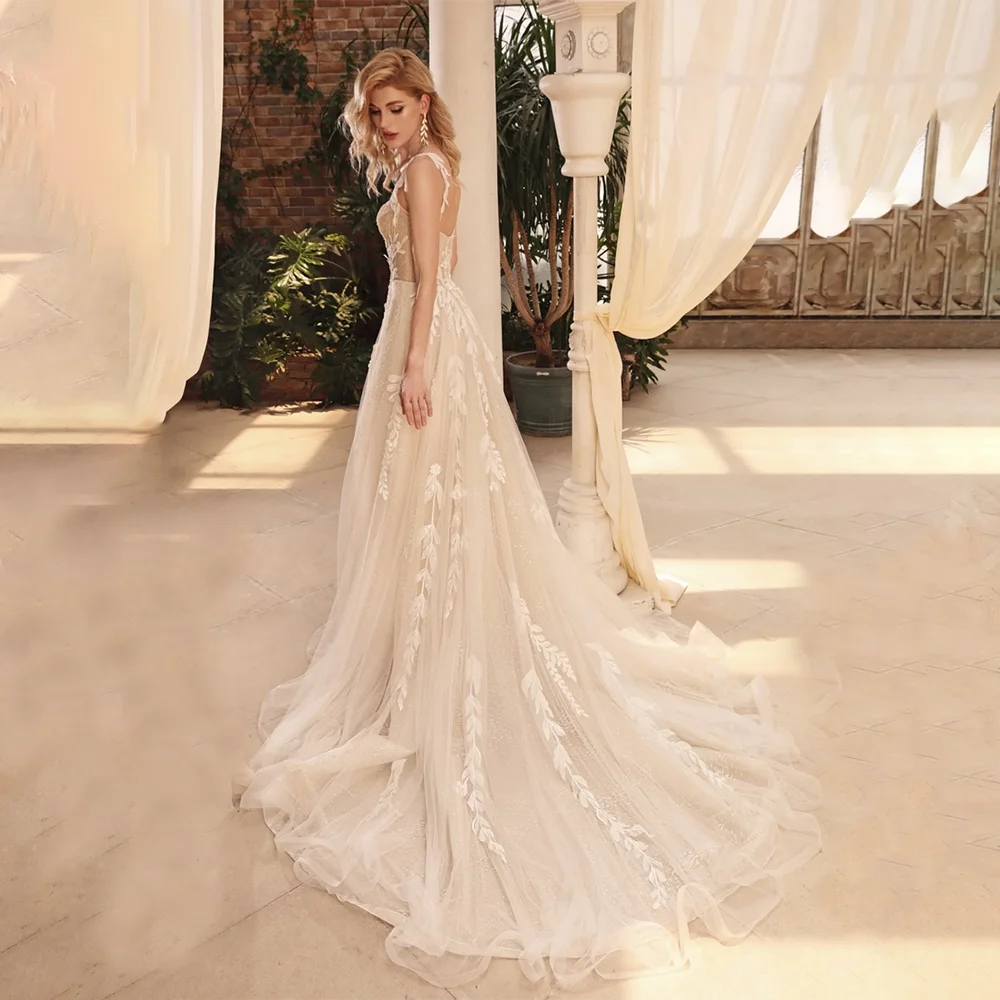 Introducing the gorgeous Robe Millie! Made with shimmering mesh and intricate embroidered lace, this dress will make you feel like a real princess on your wedding day. The sleeveless sweetheart bodice and sheer cami top add a touch of romantic elegance. Say "I do" in style with this A-line dream dress.