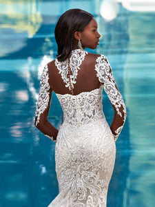 Embark on a journey of discovery and style with the Robe Odette. Crafted with a high neckline and mermaid silhouette, this wedding dress ensures your bridal look is as bold as your love story. Show them the beauty of risk-taking with an unforgettable look.