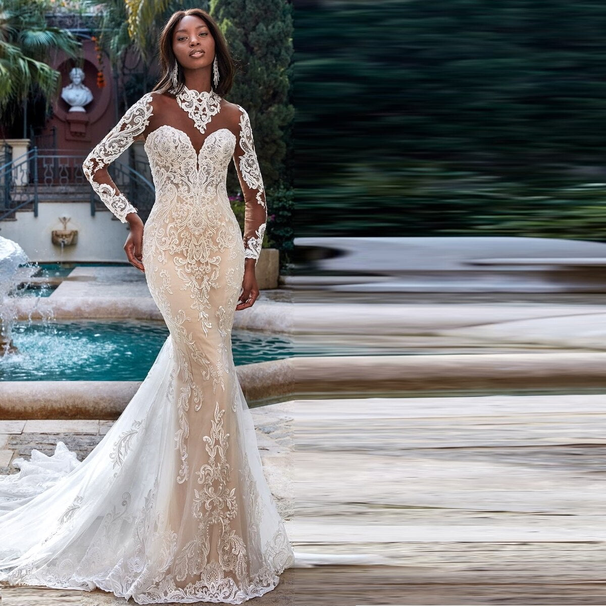 Embark on a journey of discovery and style with the Robe Odette. Crafted with a high neckline and mermaid silhouette, this wedding dress ensures your bridal look is as bold as your love story. Show them the beauty of risk-taking with an unforgettable look.