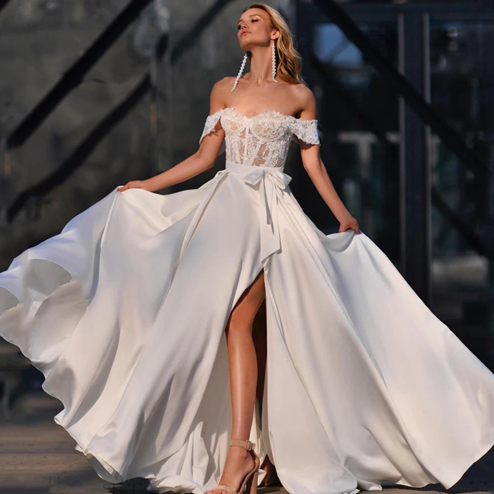 Introducing the elegant and timeless Robe Léonie. This stunning bridal gown features intricate sequins and delicate lace appliques, designed to make you shine on your special day. With a side split design, this dress adds a modern touch to a classic silhouette. Make a statement with Robe Léonie.