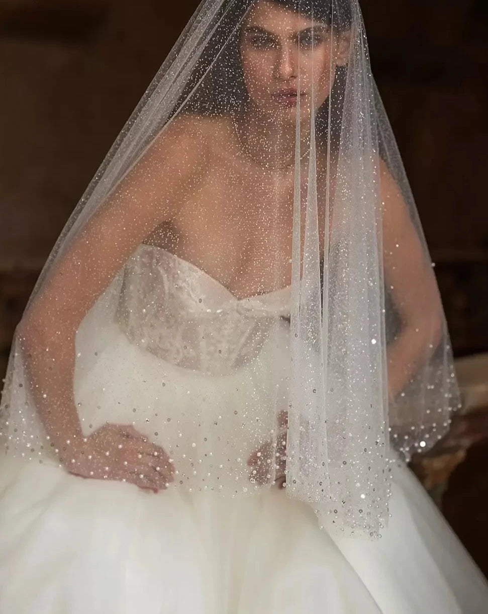 Unleash your playful and elegant side with Robe Eva! This A-line bridal gown features stunning appliques, perfect for your big day. Make a statement with this tres elegante robe, designed for the fashion-forward bride. Say oui to style!