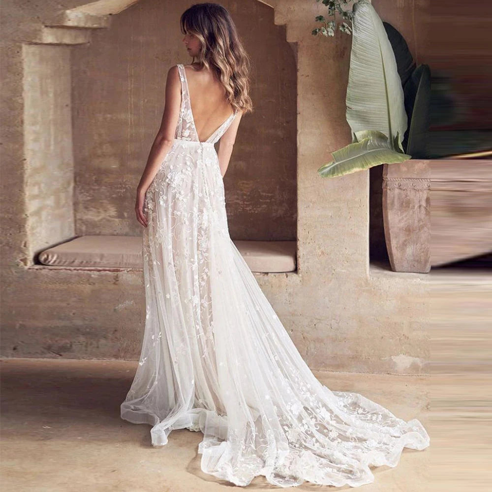 Get ready to turn heads in the stunning Dress Berenice! Perfect for a beach wedding or boho event, this elegant dress features a sexy off the shoulder neckline and v-neck with an open back design. With its flowing mopping silhouette, you'll feel like a bohemian princess on your special day.