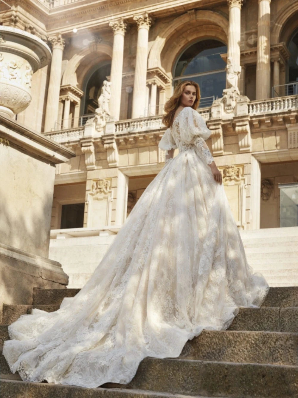 Indulge in pure elegance with our Robe Jadore. This classic applique robe features sparkling beadings and graceful long sleeves, perfect for a romantic bridal look. Embrace the luxurious ball gown silhouette and make a statement on your special day.