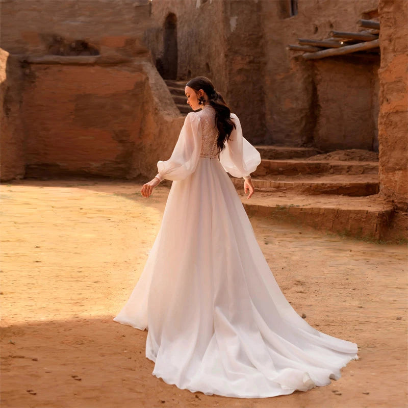 Get ready to shine on your special day with the Robe Lune! This elegant ivory white wedding dress features beautiful bubble long sleeves and high work embroidery, making it perfect for a haute couture look. You'll feel like a true bride in this stunning bridal gown. Order now and make your wedding day unforgettable!